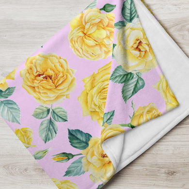 yellow and pink rose throw over blanket folded